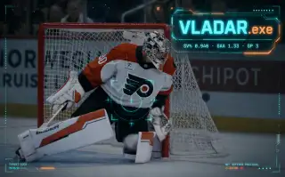 Dan Vladar of the Philadelphia Flyers clutching his right arm after a third-period crease collision with Pittsburgh Bryan Rust in Game 3 of the 2026 first-round playoff series