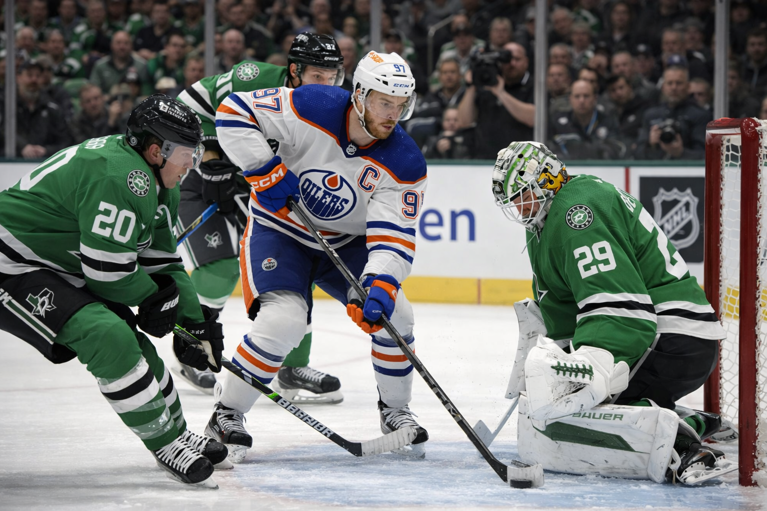 Connor McDavid #97 of the Edmonton Oilers celebrating after scoring a goal, wearing the iconic blue and orange Oilers jersey at Rogers Place